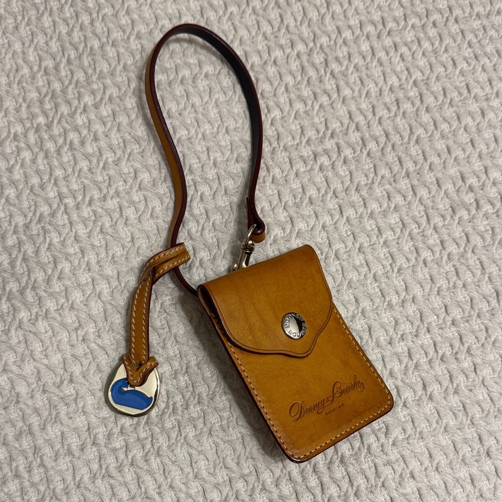 Dooney & Bourke Tan Leather wristlet/tag with charm